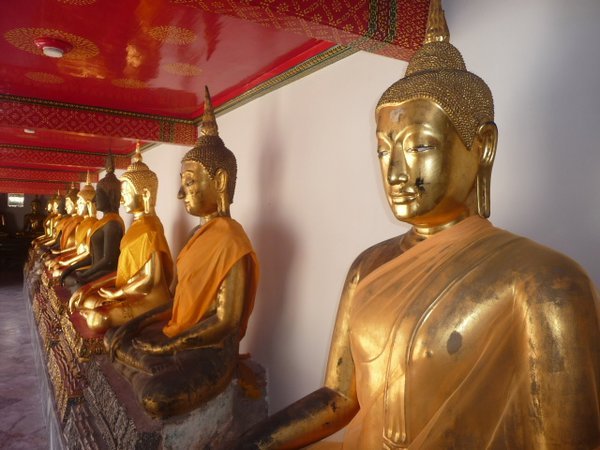 Line of Buddha statues that stretched around the courtyard.