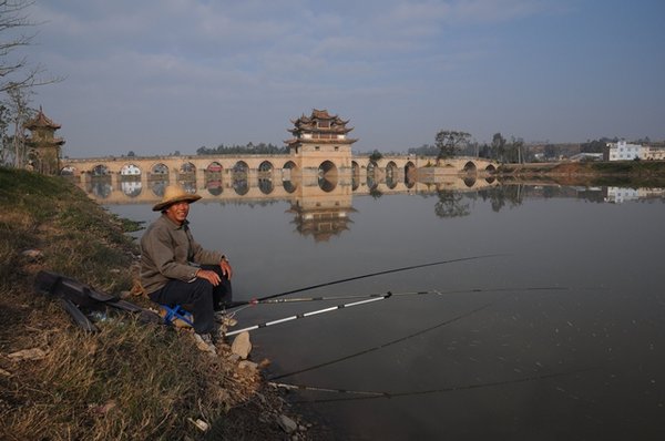 Fisherman and bridge