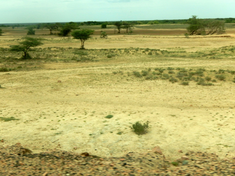 ... and dry arid landscape on the other side of the road