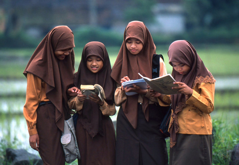 Indonesian schoolgirls reading