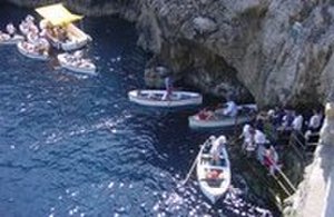 Tourist boats lined up to enter the grotto