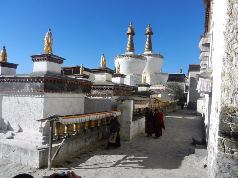 ... with prayer wheels and stupas within the monastery