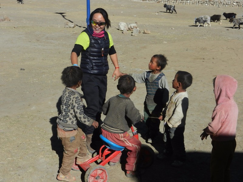 Our Tibetan guide with local kids