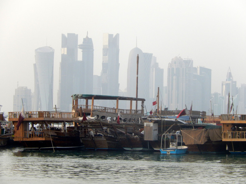 Doha city skyline behind a group of Dhows