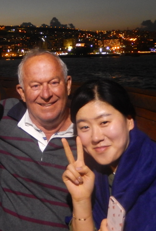Yours truly and 'Miss Korea' on the 'Jesus cruise' with Tiberias at night in the background