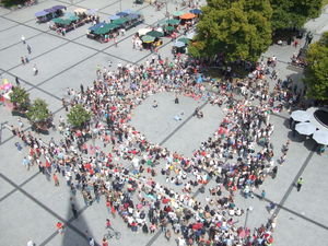 Sword swallowing busker from above