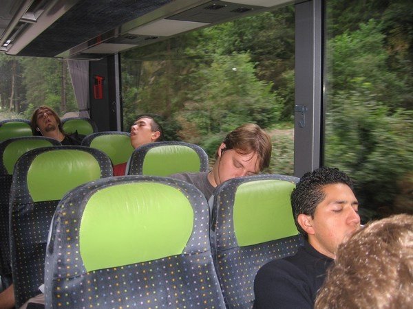 Guys sleeping on the bus ride home