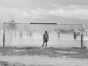 soccer in the dust