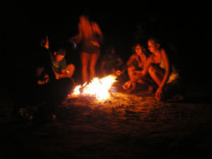 Round the campfire toasting marshmellows