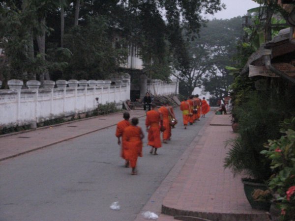 Monks going to collect alms
