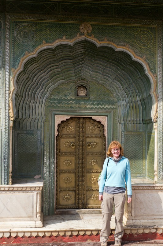 Sarah in front of the green (spring) gate in the city palace