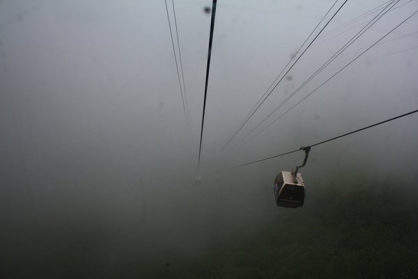 a cable car through the clouds 