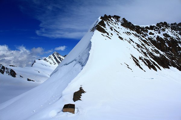 a hut at the base of the mountain