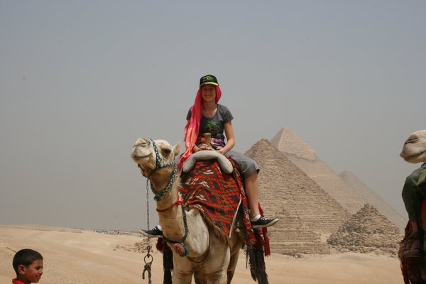 Sarah on camel at pyramids