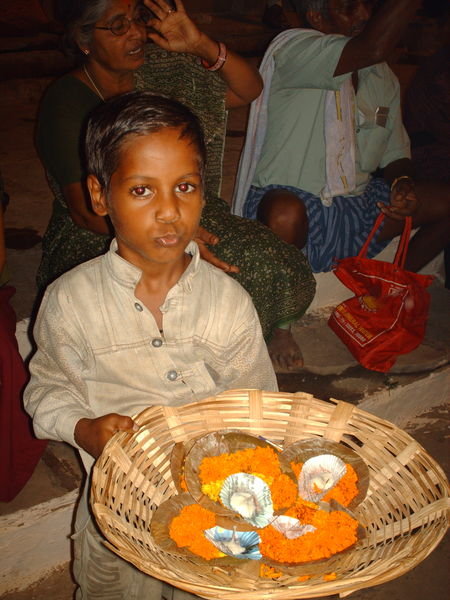 Varanasi - Boy selling puja flowers
