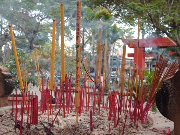 Ho Chi Minh - Incense sticks in front of a pagoda