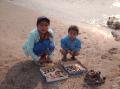 Luang Prabang - Little girls selling bracelets on the beach