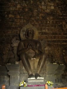 a missive Buddha in one of the temples on the way to Borobudor