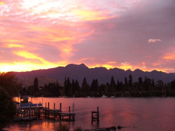 the sun rising behind the Remarkables
