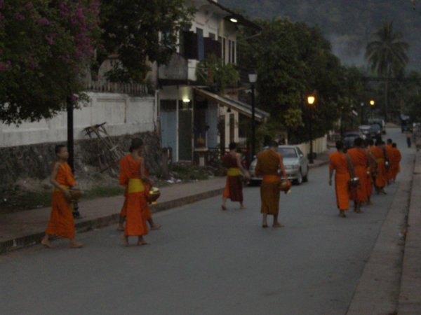 the monks walking to recieve their morning arms
