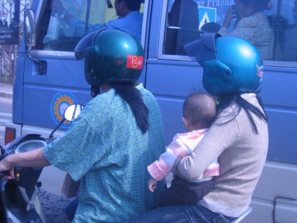 Infant on a moped