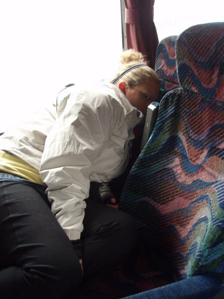Ash sleeping on a bus