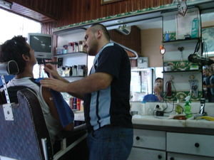 Andrae getting a shave at the barber