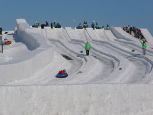 fun on the snow slide! look at the beautiful blue sky!