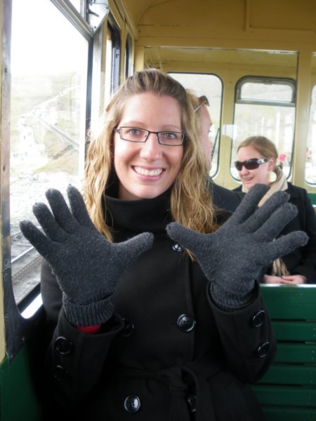 Putting gloves on! It's cold at the top of the mountain!