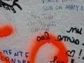 Will signs the graffiti wall at Abbey Road