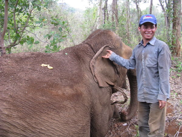 Our smiley elephant driver and our muddy elephant...