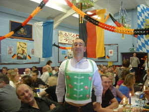 A prize winning guest wearing his prize - a ladies Oktoberfest t-shirt!