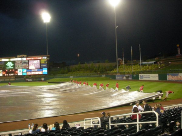 taking the tarp off the field after the delay