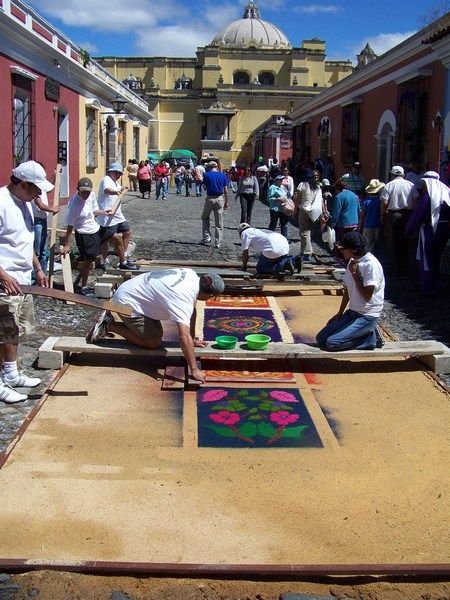 A sawdust carpet, or Alfombra, getting made