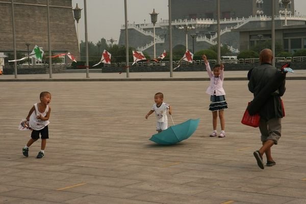 Kids with kites on Tiananmen Square