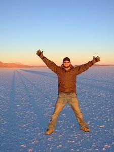 David and his huge shadow on the salt flats at sunrise