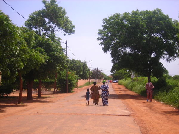 making the long walk back to the village of Keur Moussa after mass
