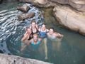 the girls swimming at the waterfall