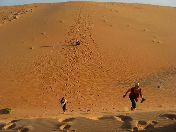 running up the giant sand dunes