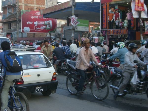 the line of motorcycles on the side of the road is one of many gas lines in Patan...it can take up to three hours to get some petrol