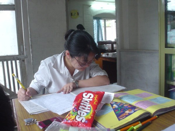Rieko hard at work on her tuberculosis research (note the HUGE bag of Skittles sitting in front of her!)
