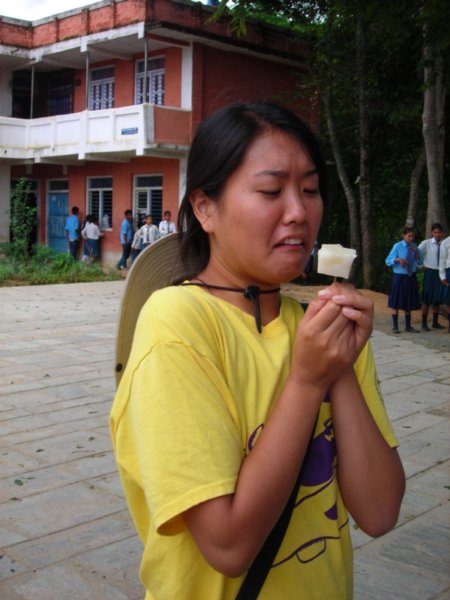 Esther eating a very questionable sweet at the secondary school