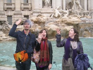 throwing coins into the Trevi fountain