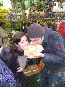 eating a massive donut Peter bought at the Christmas market