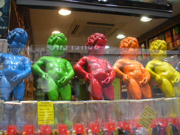 colored Manneken-Pis in the window of a candy shop
