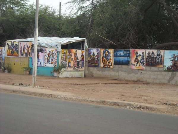 artwork being sold on the side of the road near our hotel