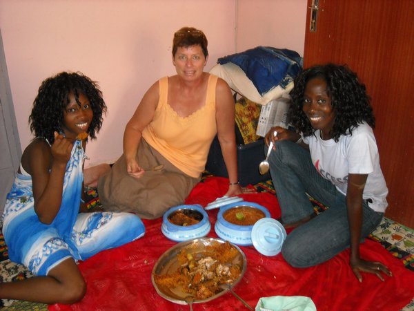 Mom, Sophie, and Véro eating ceebu jen