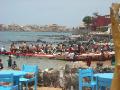 the crowded pirogues that ferry people to N'Gor Island