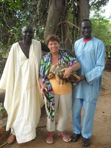 Mom with the fat turtle and various African men
