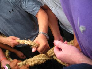 cutting a piece of the rope for good luck